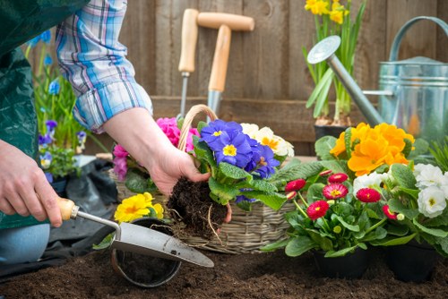 Professional garden clearance in Yeading collecting branches and debris